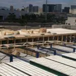 A parking lot with many wooden platforms on it