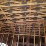 A room with many wooden beams and a ceiling.