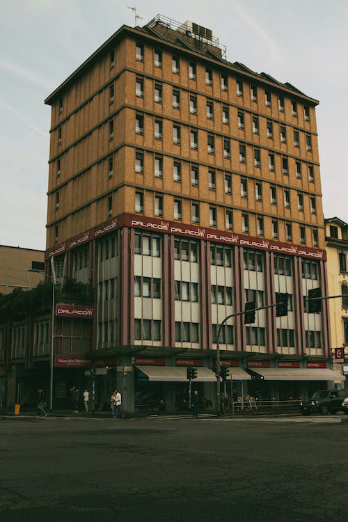 A tall building with many windows on the top of it.